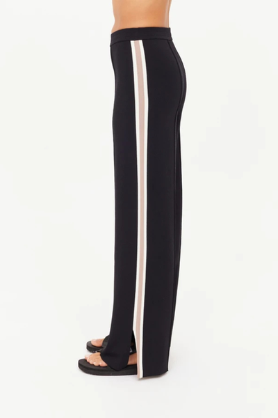 A side profile view highlighting the vertical knitted side stripes in cream and mocha, which provide a refined, athletic-inspired aesthetic.