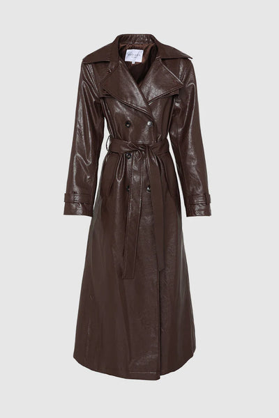 The chocolate brown Hutson Trench, displaying the textured faux leather coat fully buttoned and tied at the belted waist to highlight the long-line silhouette, double-breasted closure, and structural collar definition.