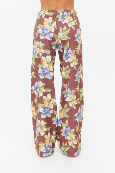 Full back view of the Isla Juliet Pant, demonstrating the drape of the wide-leg cut and the consistent application of the vintage Isla hibiscus design.