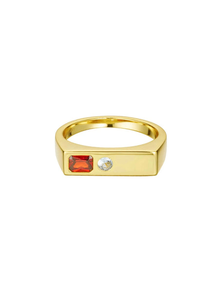 Clean product shot of the gold Sammy x Avant Studio Jessica Ring featuring a flat rectangular signet face set with an emerald-cut dark garnet and a round-cut aquamarine stone side by side