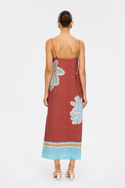 Studio rear view of a model wearing the maroon Enzo midi dress, highlighting the straight back neckline, thin self-tie shoulder straps, and fluid column silhouette.