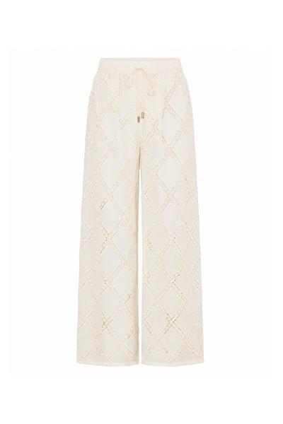 Flat-lay studio product shot of the KIVARI Izzy Pant in Cream against a white background showing the complete wide-leg cut and diamond crochet detailing.