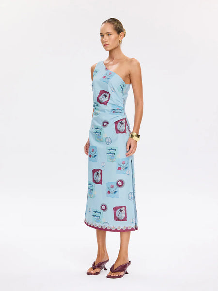 A three-quarter front angle of the blue Sintra Midi Dress, illustrating the structured bodice and the voluminous, breezy drape of the embroidered cotton.