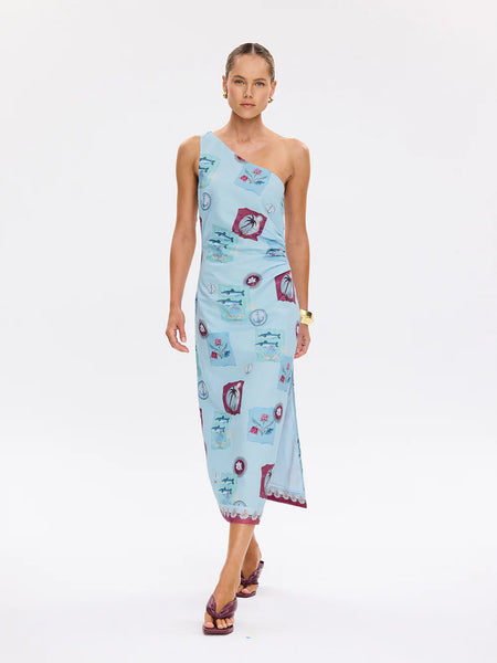 Lifestyle image featuring the Sintra Midi Dress in a natural setting, showcasing the intricate floral patterns and the feminine, flattering fit.