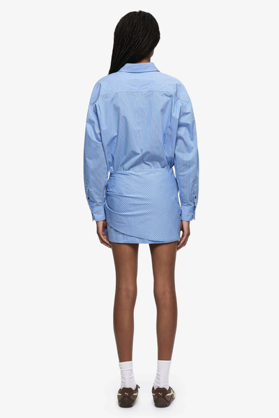 Back profile highlighting the lightweight 85% cotton fabrication and the effortless drape of the wrap-around design.