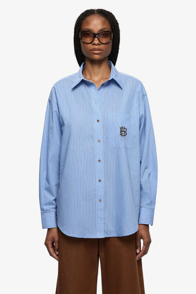Oversized Linus Shirt in Chambray Blue and white stripes, featuring a menswear-inspired silhouette and a classic button-down front.
