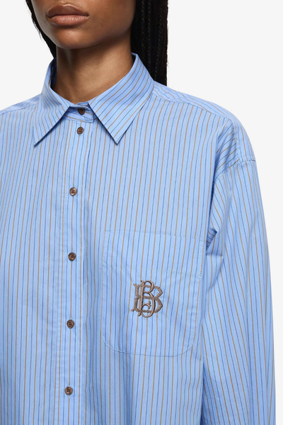 A close-up of the patch breast pocket, highlighting the tonal "BB" embroidered monogram and the crisp vertical pinstripe pattern.