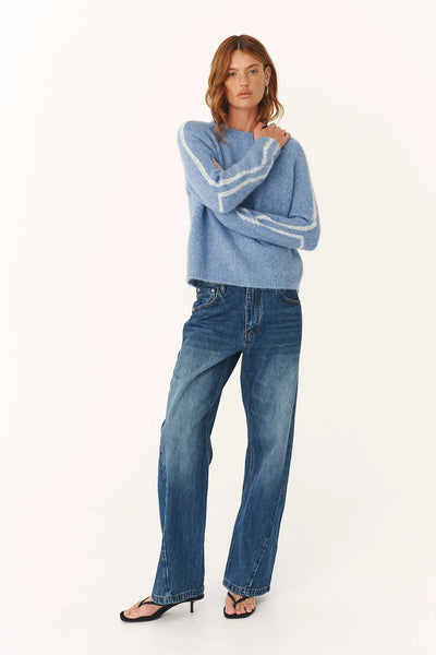 Model wearing the Lana Knit Jumper, showcasing the slightly longer boxy silhouette and the effortless drape of the raglan sleeves.
