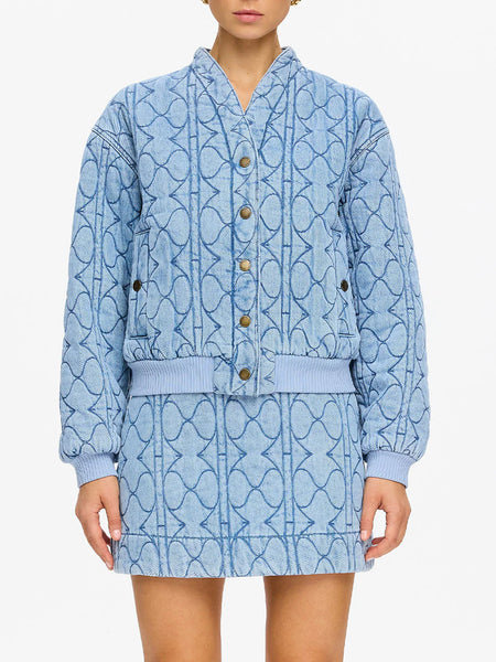A three-quarter side shot illustrating the heavy-weight cotton-lyocell fabric blend as it sits away from the body to form a modern, structured silhouette.