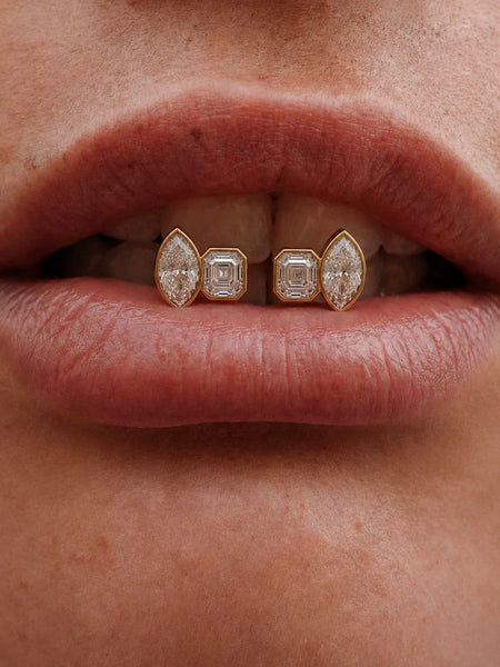 Macro detail shot featuring the earrings positioned near lips/teeth, highlighting the intricate bezel setting and multi-cut stones.