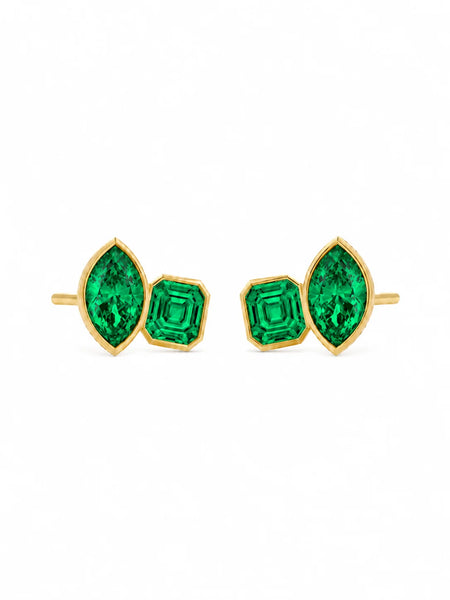 Clean studio shot of the pair of gold-plated emerald earrings against a white background, highlighting the vibrant green stones and backing posts.