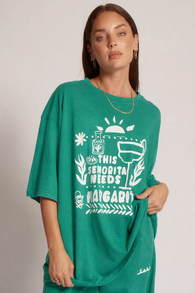Front three-quarter view of a model wearing Sabbi The Very Oversized Margie Tee in Forest Green, highlighting the vintage wash and oversized silhouette.