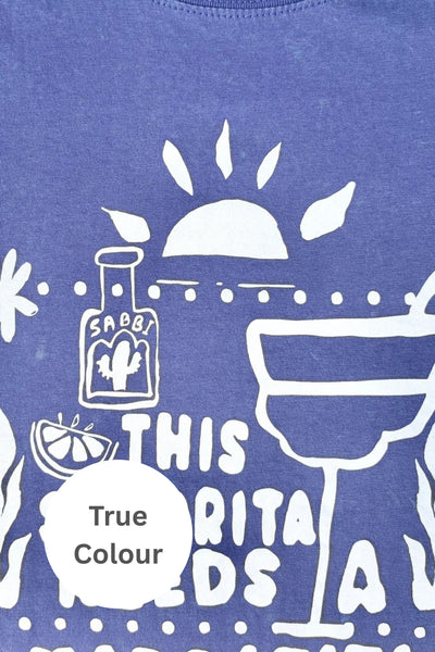 Close-up view of the white hand-drawn "This Señorita Needs A Margarita" graphic on Sabbi The Very Oversized Margie Tee in Royal Blue.