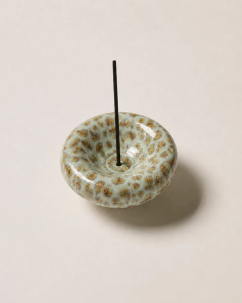 High-angle studio view of the Gentle Habits Vessel Incense Holder in Seafoam holding an upright incense stick on a clean white backdrop.