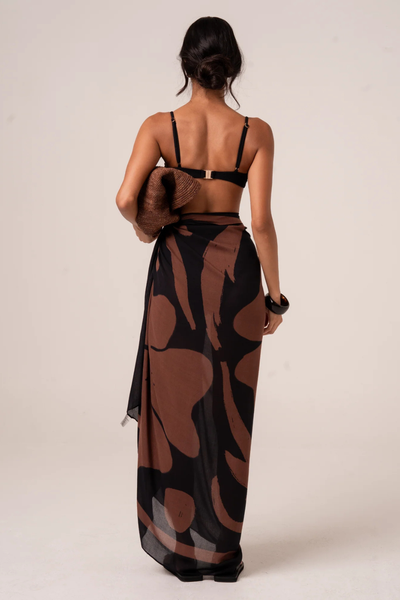 A full back view of the Alba Sarong on a model, highlighting the generous 170x130cm dimensions that provide elegant, adjustable coverage across the seat and thighs.