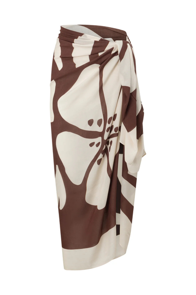 Product studio shot of the Ochre Lane Ibisco Sarong draped and tied as a waist wrap skirt on a invisible mannequin, showcasing the large hibiscus floral pattern in brown and beige tones.