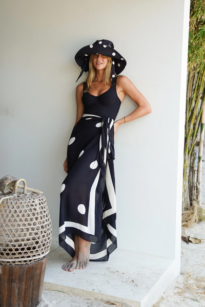 A closer front e-commerce image highlighting the clean fit around the crown, tailored to a 55cm circumference, styled with the slender self-ties left loose.
