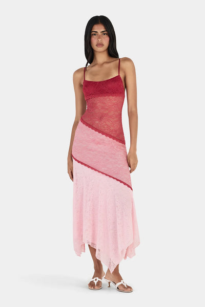 Front view of model wearing the Ownley Alida Midi Dress in Ballet Splice, featuring a lace bodice, sheer lace waist panel, color-blocked skirt, and white low-heeled mules.
