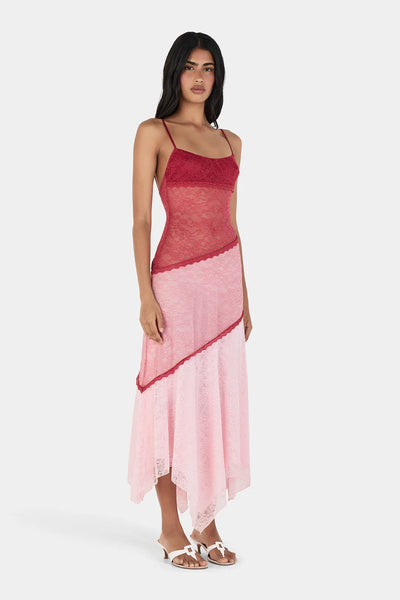 Three-quarter studio view of model in the Ownley Alida contrast lace midi dress in Ballet Splice, highlighting the spaghetti straps, fitted silhouette, and handkerchief hem.