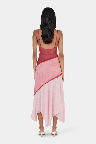 Back view of model wearing the Ownley Alida Midi Dress in Ballet Splice, displaying the low-cut back with adjustable thin straps and diagonal lace paneling.