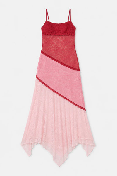 Flat lay shot of the Ownley Alida Midi Dress in Ballet Splice showing contrast lace panels in deep red, mid-pink, and pale pink with an asymmetrical handkerchief hemline.
