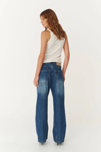 Studio model wearing the Percy jeans, showcasing the structured barrel leg and the relaxed, slightly cropped fit on an 180cm frame.