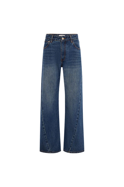 High-waisted Percy Curve Seam Jeans in a faded classic indigo wash, featuring a modern barrel leg silhouette and twisted seam details.