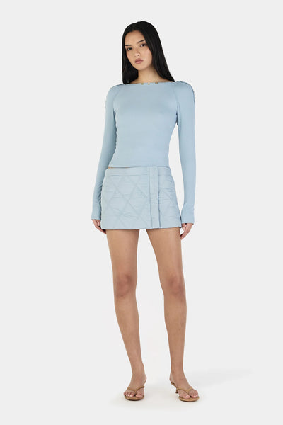 A detailed close-up shot focusing on the wide collar construction, showcasing the decorative front buttons running along the shoulder seams and the top's alternative off-shoulder adjustable styling.
