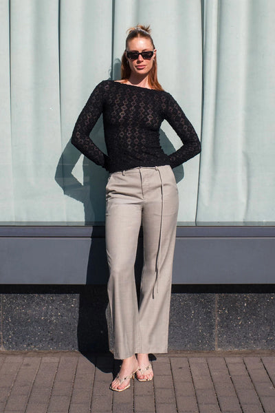 Front view of the Samantha top in Noir, illustrating the sophisticated boat neckline and the lightweight, breathable nature of the fabric.