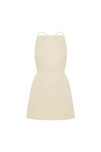 Ghost mannequin front product shot of the butter creme linen twill mini dress on a neutral white background.