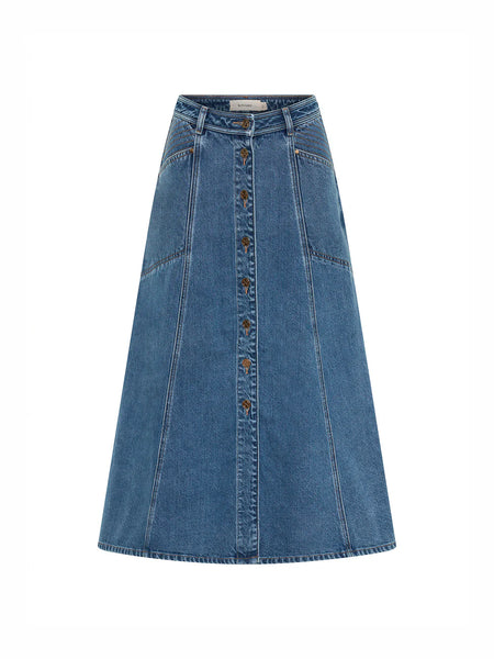 A straight-on, standalone e-commerce product layout shot of the Kivari Rita Denim Midi Skirt in Drift Blue against a solid white background, clearly displaying its symmetric paneling, contrast stitching, and full button-down front structure.