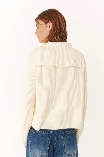 Back profile focusing on the seamless transition of the sailor collar over the shoulders and the long, relaxed sleeves.