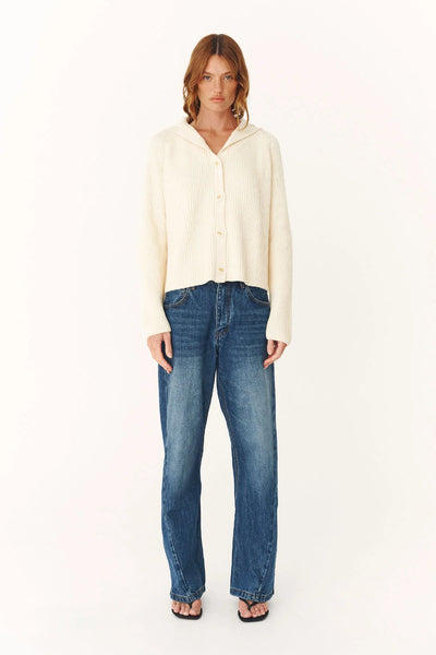 Model wearing the Snow Saylor cardigan, illustrating the relaxed fit and lightweight drape of the zero-waste knit construction.