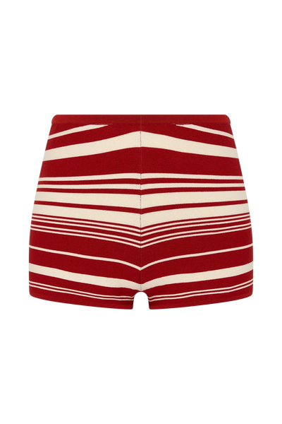 Rear product shot of the fine-knit mini shorts featuring horizontal red ochre and cream stripes against a plain white background.