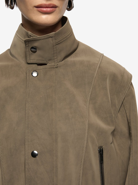 A macro close-up view focusing on the jacket collar and front placket, detailing the premium texture grain of the PU-rayon faux-suede blend and the polished metal press-stud accents.