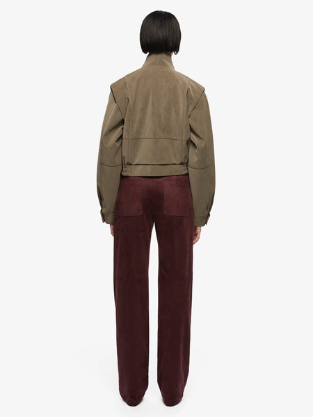 A full back studio view on a model, illustrating the clean horizontal panel stitching across the shoulders and the secure, cinched fit of the elasticated waistband.