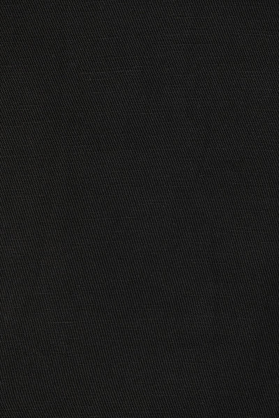 Close-up fabric texture shot displaying the smooth, fluid weave of the black lyocell-linen blend material.