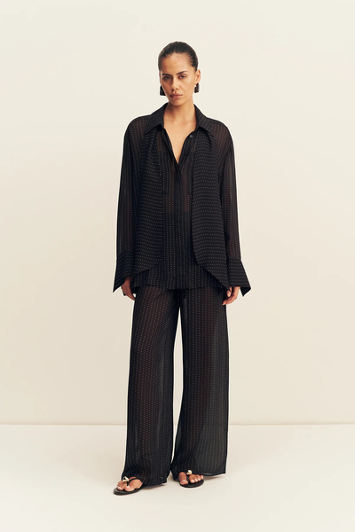 Full-length front view of a model wearing the Shona Joy Irving Polka Dot Sheer Shirt as a co-ord matching set with sheer polka dot trousers.