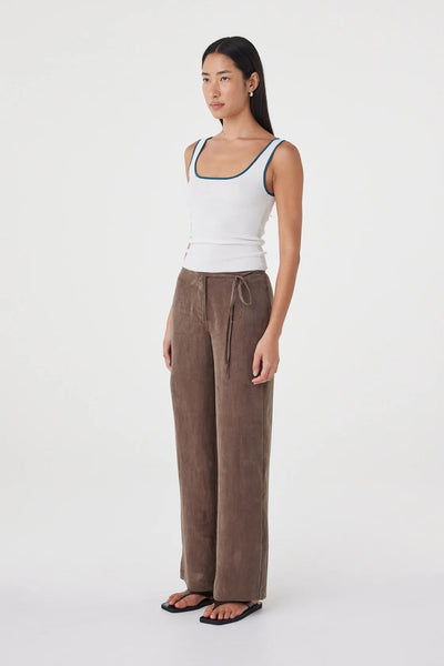 Waist-up side close-up highlighting the slim side tie accent and smooth cupro-blend texture.