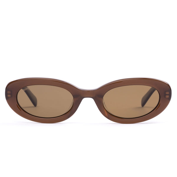 Front view studio shot of the Sito Shades Lourdes oval sunglasses in translucent milky coco brown acetate with solid light brown polarised lenses on a white background.