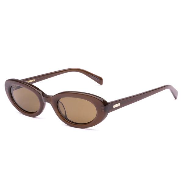 Three-quarter studio view of the Sito Shades Lourdes oval sunglasses in translucent milky coco brown with brown polarised lenses.