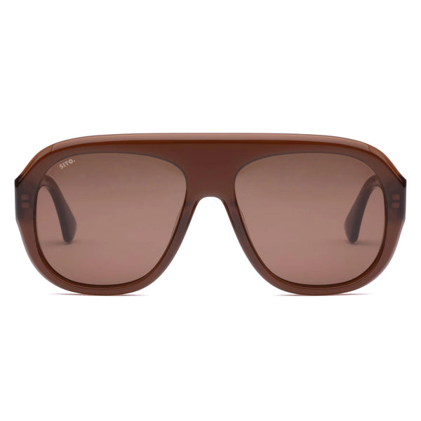 Direct front product view of oversized Sito Shades Paloma aviator sunglasses featuring a flat top bar, translucent milky coco brown acetate frame, and warm brown-tinted lenses.