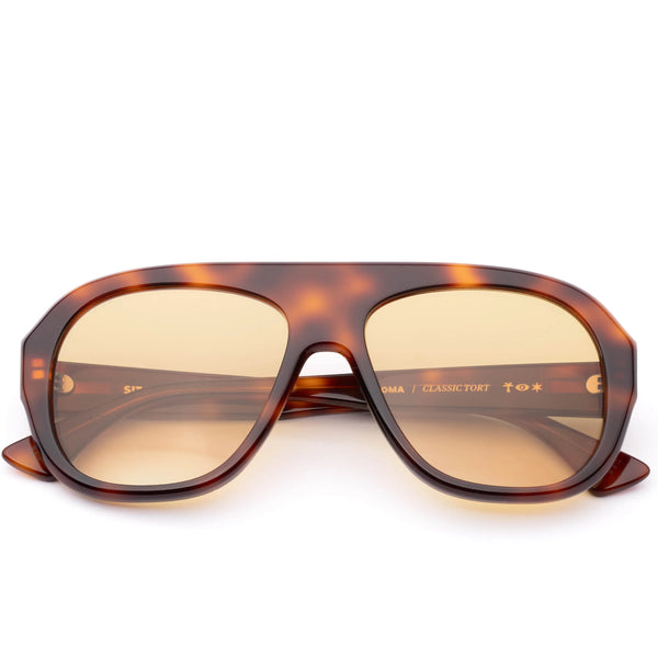 Front product shot of Sito Shades Paloma classic tort aviator sunglasses folded flat, showing the inner temple branding reading "PALOMA | CLASSIC TORT".