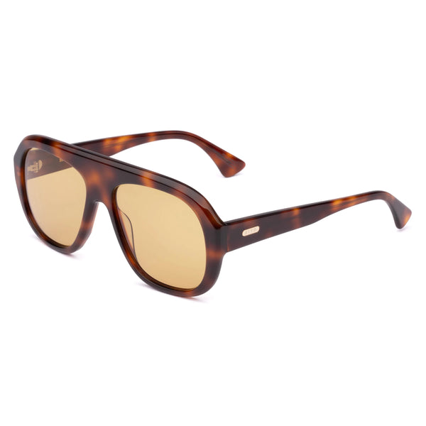 Three-quarter angle front view of oversized classic tort aviator sunglasses with yellow lenses, thick top bar construction, and sturdy tortoiseshell temple arms.