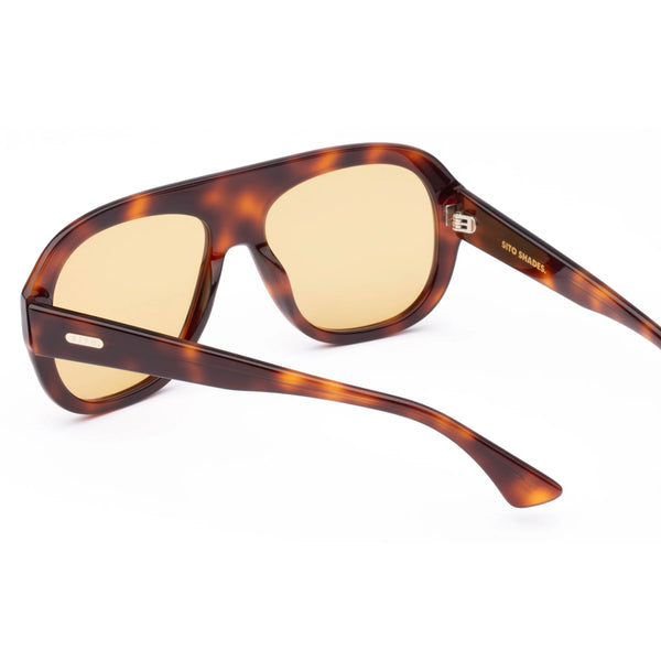 Rear elevated perspective view of Sito Shades Paloma tortoiseshell aviator sunglasses, showcasing the interior temple frame details, hinges, and yellow-tinted lenses.