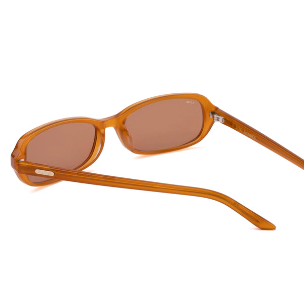 Back perspective studio view of the Sito Shades Roux sunglasses in translucent caramel orange acetate showing silver hinges and inner temple branding.