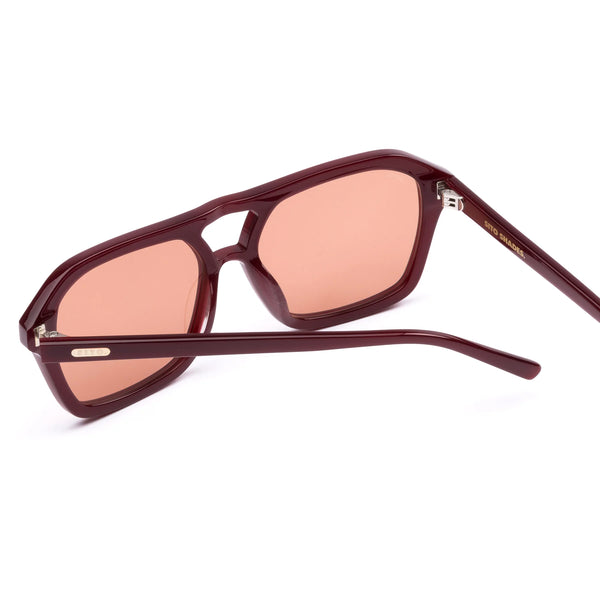 A crisp side-profile product shot highlighting the right temple arm of the milky berry frames. The image showcases the streamlined tapering of the acetate arms, a gold-toned "SITO" branding plaque inlaid near the temple hinge, and fine printed product text regarding lens categories and UV protection standards along the inner arm tip.