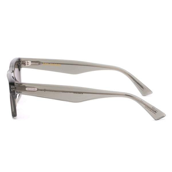 Side profile studio image of the Sito Shades Vincent sunglasses highlighting slim translucent Nori green acetate arms with silver logo pin detailing on a plain white background.