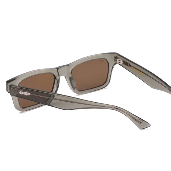 Back perspective view of the Sito Shades Vincent sunglasses in translucent green Nori acetate showing silver hinges, brown lenses, and inner temple branding on a white background.