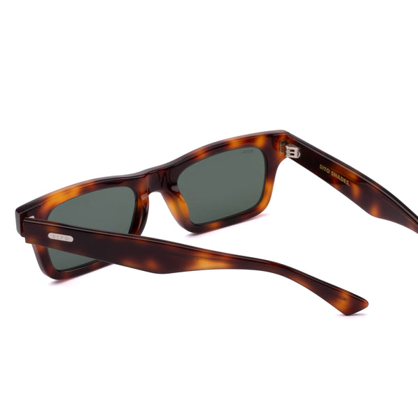 Back perspective studio view of the Sito Shades Vincent sunglasses in translucent tortoiseshell acetate displaying silver hinges, grey lenses, and inner temple branding.